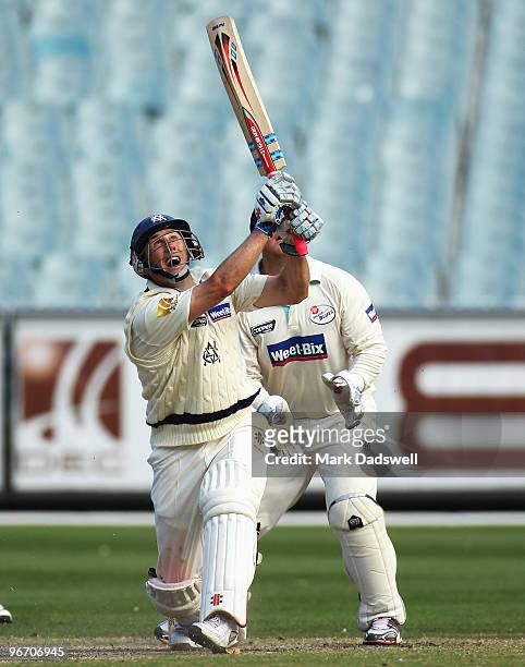 David Hussey of the Bushrangers skies a shot and is caught off the bowling of Steve O'Keefe of the Blues during day four of the Sheffield Shield...