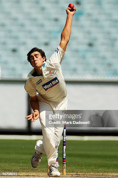 Mitchell Starc of the Blues bowls during day four of the Sheffield Shield match between the Victorian Bushrangers and the Queensland Bulls at...
