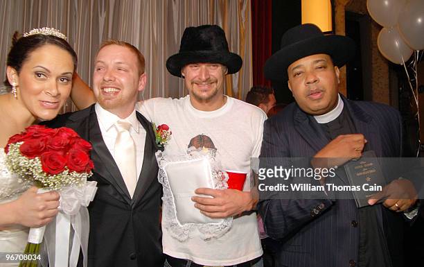 From left, Sergeants Rebecca Hernandez and Brad Tarr of Manassas, Virginia pose for photos with Kid Rock and Rev Run of Run DMC after they were...