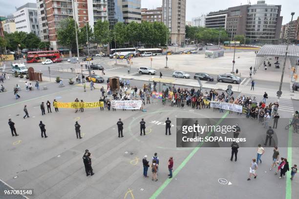 Policemen seen looking at the protesters during the demonstration. Hundred UCFR supporters manifested in Barcelona against the political act of the...