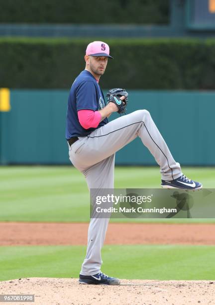 James Paxton of the Seattle Mariners throws a warm-up pitch while wearing a pink hat and shirt to honor Mother's Day during the game against the...