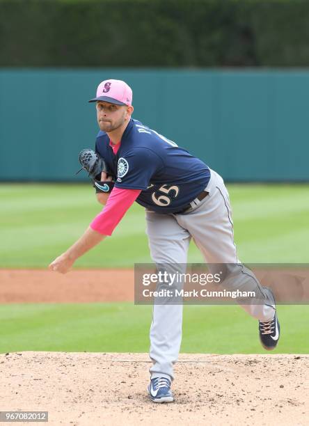 James Paxton of the Seattle Mariners throws a warm-up pitch while wearing a pink hat and shirt to honor Mother's Day during the game against the...