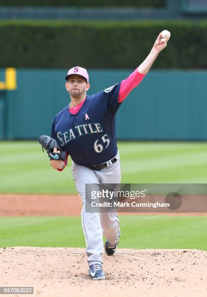 James Paxton of the Seattle Mariners throws a warm-up pitch while wearing a pink hat and shirt to honor Mother's Day during the game against the...
