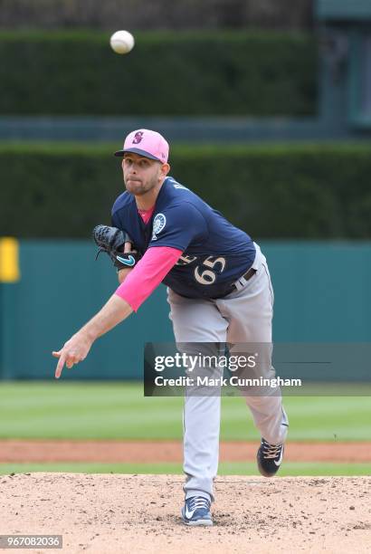 James Paxton of the Seattle Mariners throws a warm-up pitch while wearing a pink hat and shirt to honor Mother's Day during the game against the...