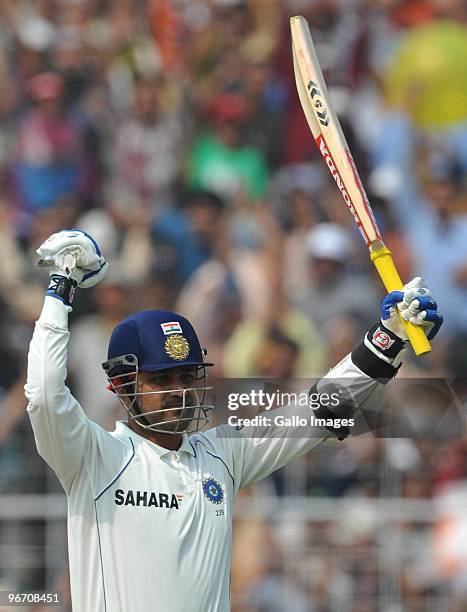 Virender Sehwag of India celebrates his 100 during day two of the Second Test match between India and South Africa at Eden Gardens on February 15,...