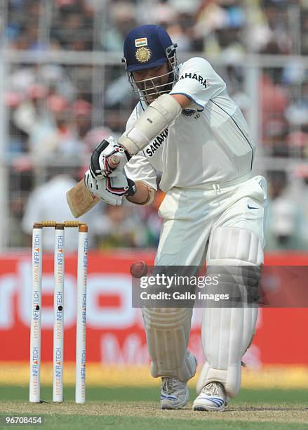 Sachin Tendulkar of India drives through the covers during day two of the Second Test match between India and South Africa at Eden Gardens on...