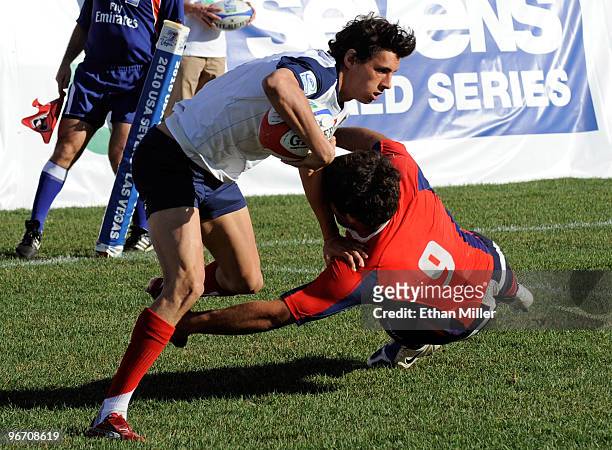 Yan Ruel of France gets away from Ricardo Sifri of Chili to score a try during the IRB Sevens World Series semifinal match between France and Chili...