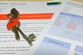House keys on a bank letter informing customer of Mortgage Arrears and repossession  with bank statement