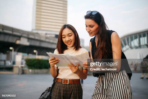 young traveler woman asking a local about guidelines - tourist asking stock pictures, royalty-free photos & images