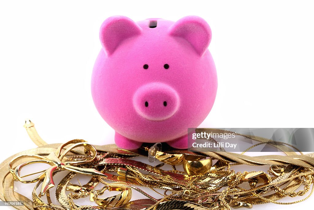 Piggy Bank on Pile of Gold