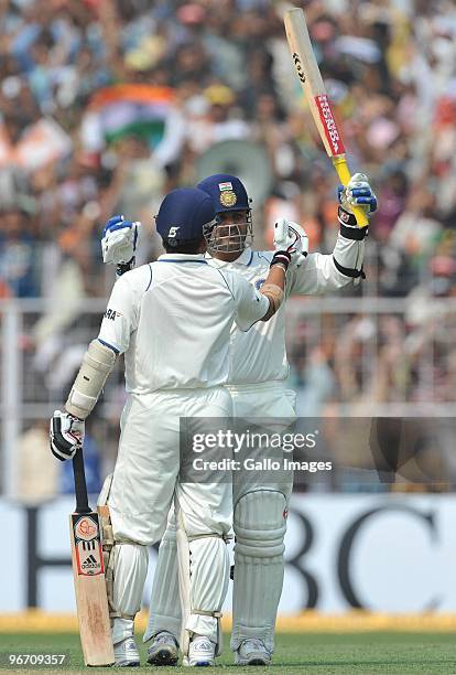 Virender Sehwag of India celebrates his 100 with Sachin Tendulkar during day two of the Second Test match between India and South Africa at Eden...