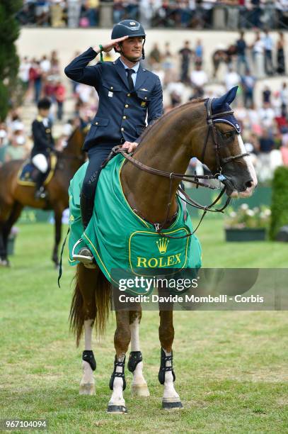 Lorenzo DE LUCA of Italy, riding HALIFAX VAN HET KLUIZEBOS, during during the award ceremony Rolex Grand Prix Piazza di Siena on May 27, 2018 in...