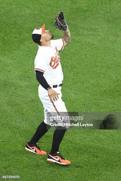 Jace Peterson of the Baltimore Orioles catches a fly ball during a baseball game against the Washington Nationals at Oriole Park at Camden Yards on...