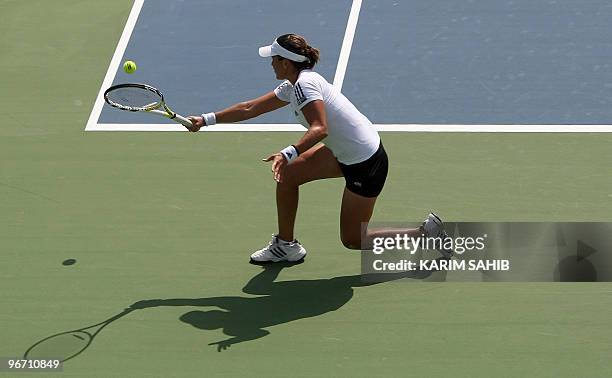 Spain's Anabel Medina Garrigues returns the ball to India's Sania Mirza during their WTA Dubai Tennis Championships first round match in the Gulf...