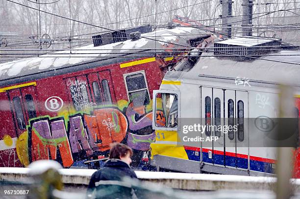 The wreckage of two passenger trains sits on the tracks following a collission at Halle on February 15, 2010. Two packed commuter trains collided...