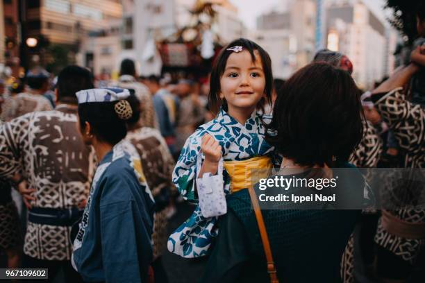 cute toddler girl in yukata carried by mother at traditional japanese festival - sanja festival stock pictures, royalty-free photos & images