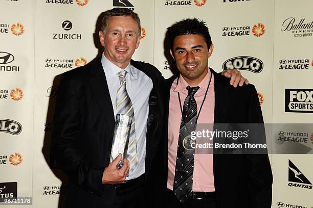 Carlos Hernandez poses with the Johnny Warren Medal award and Ernie Merrick poses with The Coach of the Year award during the 2010 A-League Awards at...