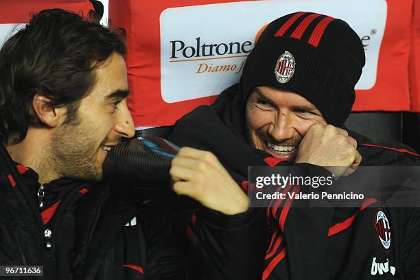 David Beckham of AC Milan speaks and smiles with Mathieu Flamini prior to the Serie A match between AC Milan and Udinese Calcio at Stadio Giuseppe...