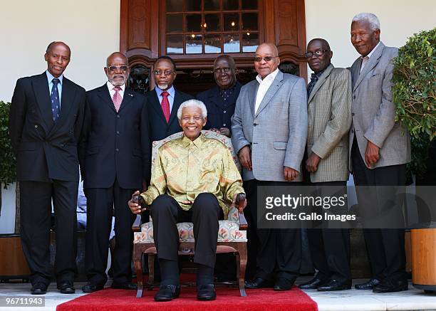 President Jacob Zuma with former South African president Nelson Mandela pose during a luncheon for men from the Rivonia trials and political veterans...