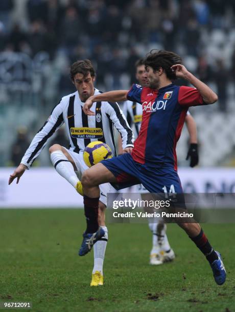 Claudio Marchisio of Juventus FC is challenged by Giuseppe Sculli of Genoa CFC during the Serie A match between Juventus FC and Genoa CFC at Stadio...