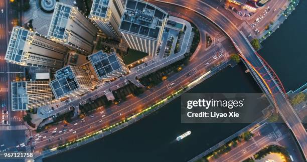 aerial view of buildings along the river - liyao xie stock-fotos und bilder