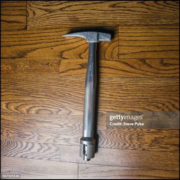 The geology hammer belonging to American astronaut Alan Bean , lying on his wooden studio floor, which he used and brought back from the moon and...