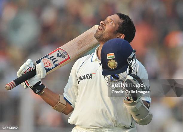 Sachin Tendulkar of India celebrates his 47th test hundred during day two of the Second Test match between India and South Africa at Eden Gardens on...