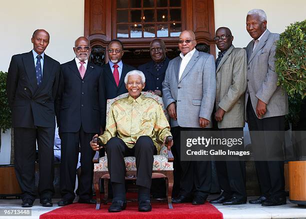 President Jacob Zuma with former South African president Nelson Mandela pose during a luncheon for men from the Rivonia trials and political veterans...