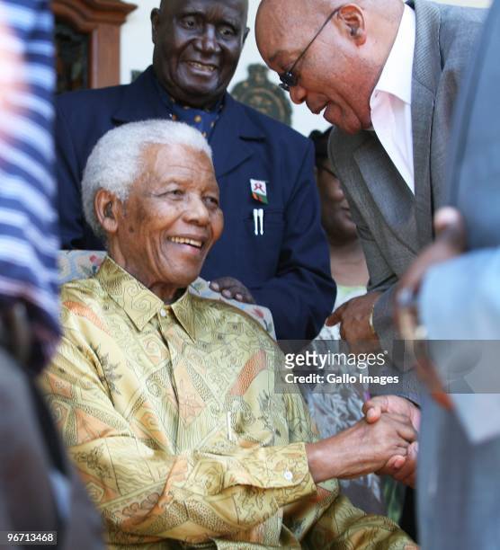 President Jacob Zuma speaks with former South African president Nelson Mandela during a luncheon for men from the Rivonia trials and political...