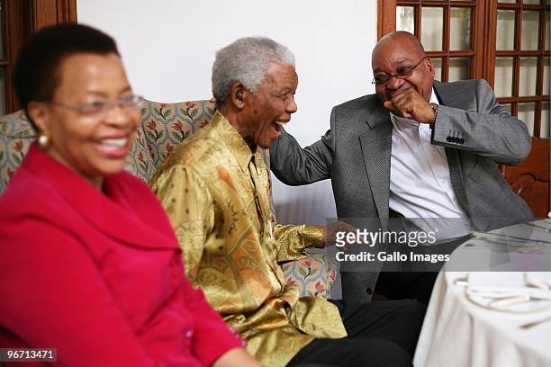 President Jacob Zuma laughs with former South African president Nelson Mandela during a luncheon for men from the Rivonia trials and political...