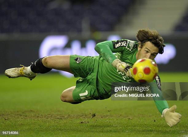 Academica's goalkeeper Ricardo Nunes stops the ball during their Portuguese League Cup semi-final football match against FC Porto at the Dragao...