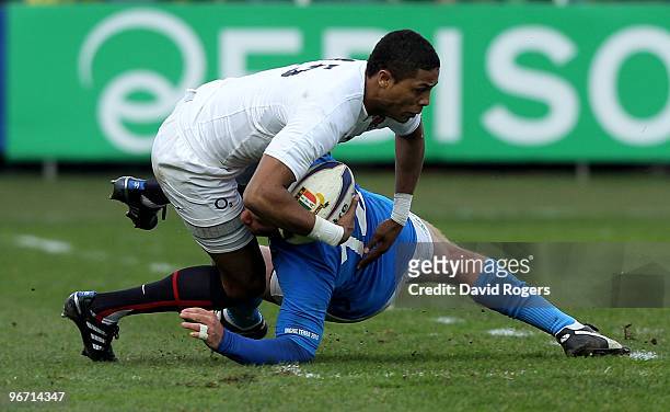 Delon Armitage of England is tackled by Gonzalo Garcia during the RBS Six Nations match between Italy and England at Stadio Flaminio on February 14,...