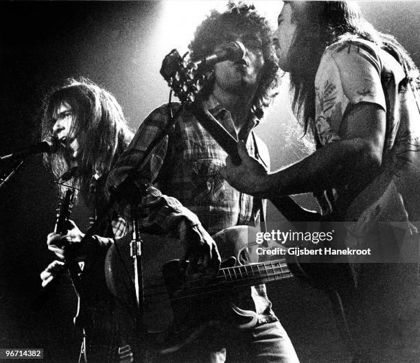 Neil Young performs live on stage with Billy Talbot and Frank Sampedro from Crazy Horse in Copenhagen, Denmark on March 16 1976