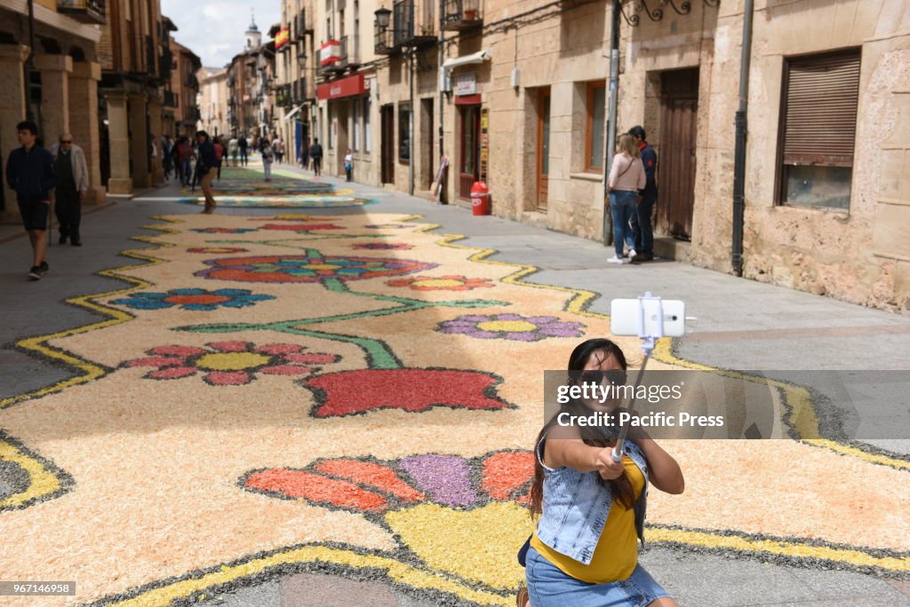 A woman takes a selfie during the Corpus Christi feast in '...