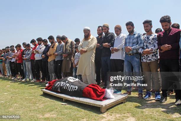 People carry the body of 23 yr old orphan and lone brother of two sisters Qaiser Amin Bhat who succumbed to his injuries after Indian paramilitary...