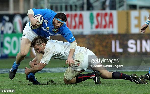 Matias Aguero of Italy is tackled by Lewis Moody during the RBS Six Nations match between Italy and England at Stadio Flaminio on February 14, 2010...