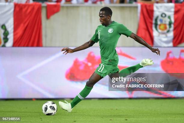 Saudi Arabia's midfielder Abdulmalek Al-Khaibri controls the ball during an international friendly football match between Saudi Arabia and Peru at...