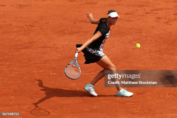 Elise Mertens of Belgium plays a backhand during the ladies singles fourth round match against Simona Halep of Romania during day nine of the 2018...