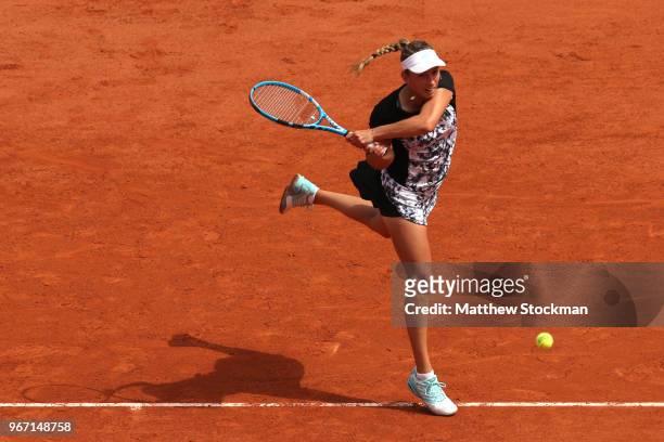 Elise Mertens of Belgium plays a backhand during the ladies singles fourth round match against Simona Halep of Romania during day nine of the 2018...
