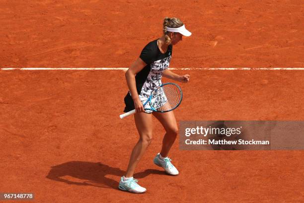 Elise Mertens of Belgium celebrates during the ladies singles fourth round match against Simona Halep of Romania during day nine of the 2018 French...