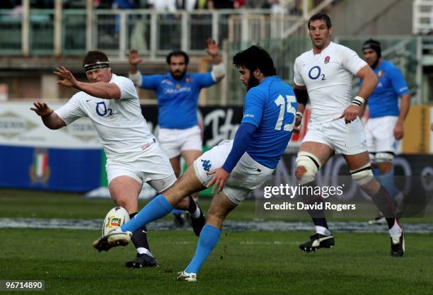 Luke McLean of Italy kicks the ball past Dylan Hartley during the RBS Six Nations match between Italy and England at Stadio Flaminio on February 14,...