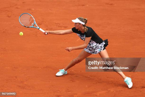 Elise Mertens of Belgium plays a forehand during the ladies singles fourth round match against Simona Halep of Romania during day nine of the 2018...