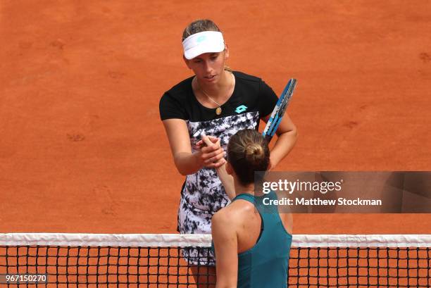 Elise Mertens of Belgium congratulates Simona Halep of Romania on victory in the ladies singles fourth round match during day nine of the 2018 French...