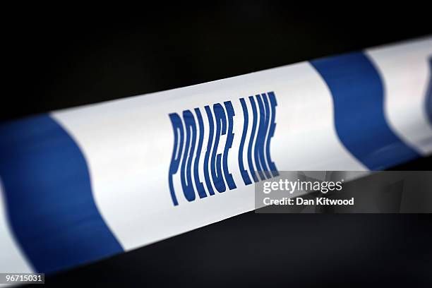 Police tape marks off an area where a man was stabbed and killed in South Norwood on February 15, 2010 in London, United Kingdom. As the UK gears up...