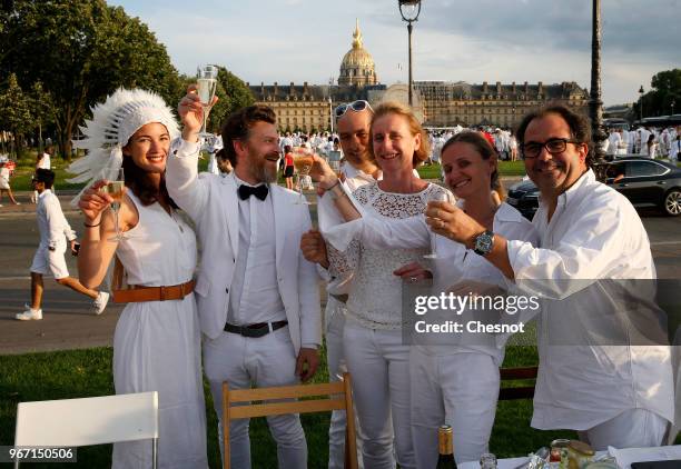 People dressed in white gather for the 30th edition of the 'Diner En Blanc' event on the Invalides esplanade on June 3, 2018 in Paris, France. The...