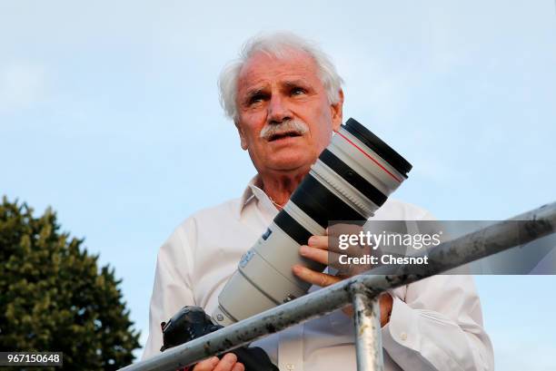 French photographer Yann Arthus Bertrand is seen during the 30th edition of the 'Diner En Blanc' event on the Invalides esplanade on June 3, 2018 in...