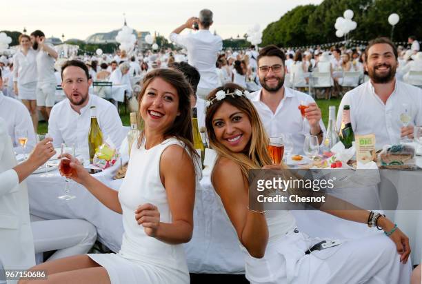 People dressed in white gather for the 30th edition of the 'Diner En Blanc' event on the Invalides esplanade on June 3, 2018 in Paris, France. The...