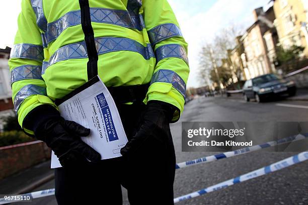 Police officer stands beside a cordon after a man was stabbed and killed in South Norwood on February 15, 2010 in London, United Kingdom. As the UK...