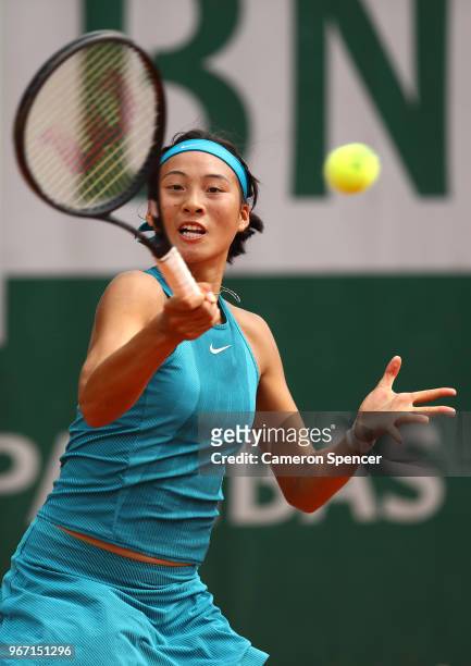 Qinwen Zheng of China in action during the girls singles first round match against Hong Yi Cody Wong of Hongkong during day nine of the 2018 French...