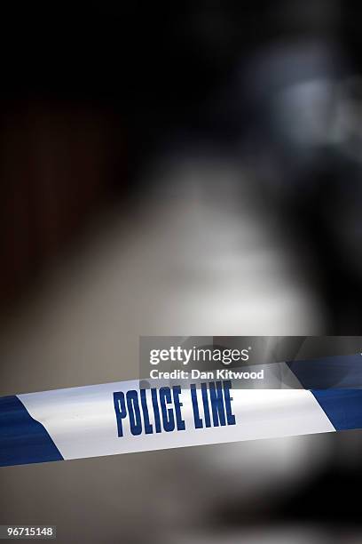 Police tape marks off an area where a man was stabbed and killed in South Norwood on February 15, 2010 in London, United Kingdom. As the UK gears up...